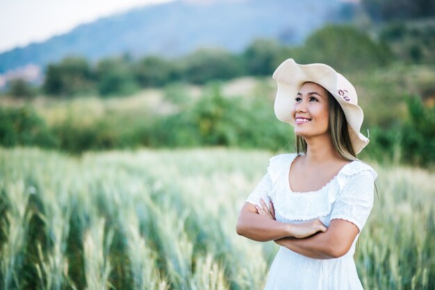 Woman in the hat happiness in the nature