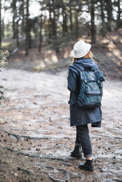 Woman in hat walking in nature