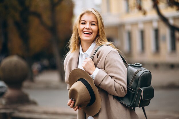 Woman in hat with bag travelling