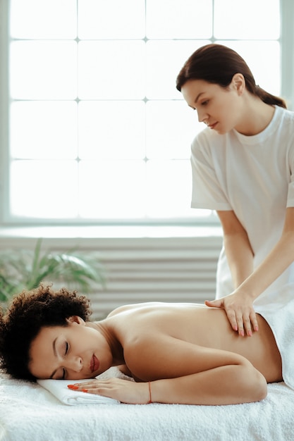 Woman having back massage and treatment