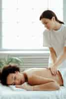 Free photo woman having back massage and treatment