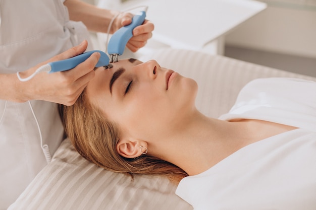 Woman having beauty treatment procedures in a salon