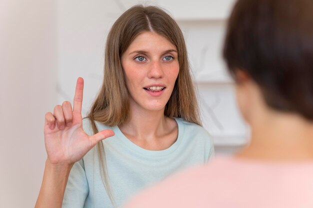 Woman having a chat with someone using the sign language