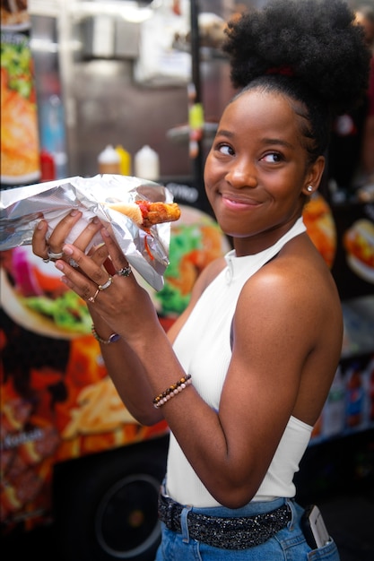 Free photo woman having fun at food festival