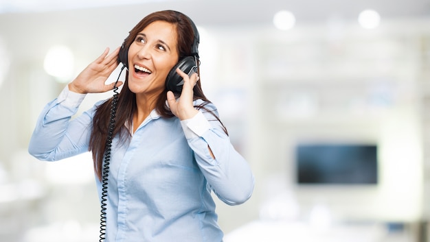 Woman having fun while listening to music