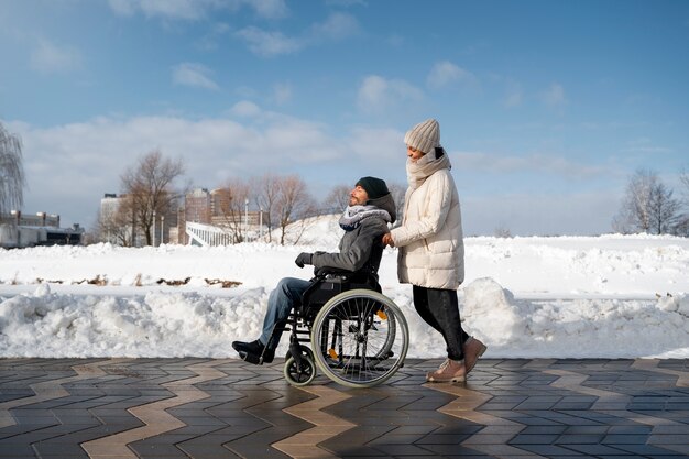 Woman having fun with her her disabled friend