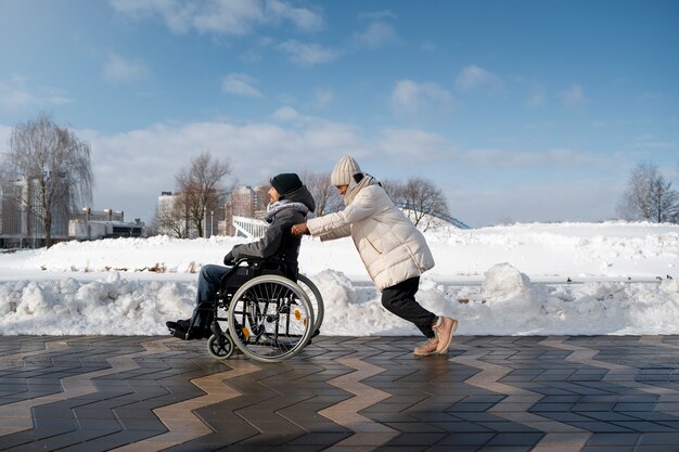 Woman having fun with her her disabled friend