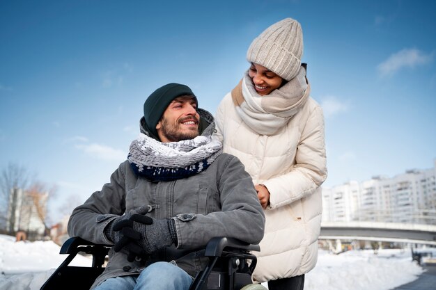 Free photo woman having fun with her her disabled friend