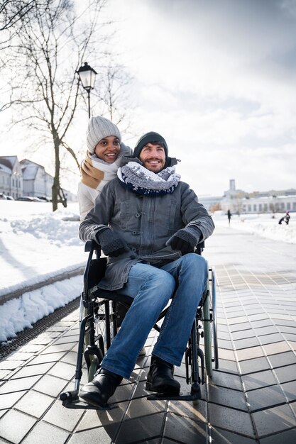 Woman having fun with her her disabled friend