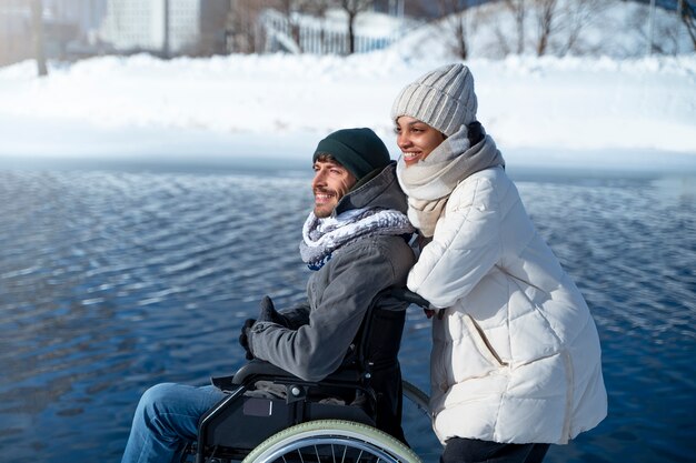 Woman having fun with her her disabled friend