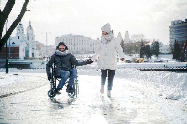 Woman having fun with her her disabled friend