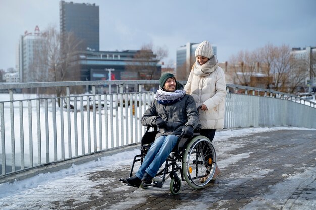 Woman having fun with her her disabled friend