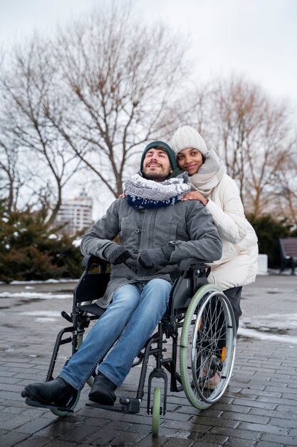 Woman having fun with her her disabled friend