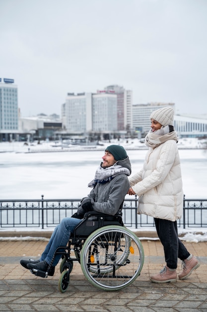 Free photo woman having fun with her her disabled friend