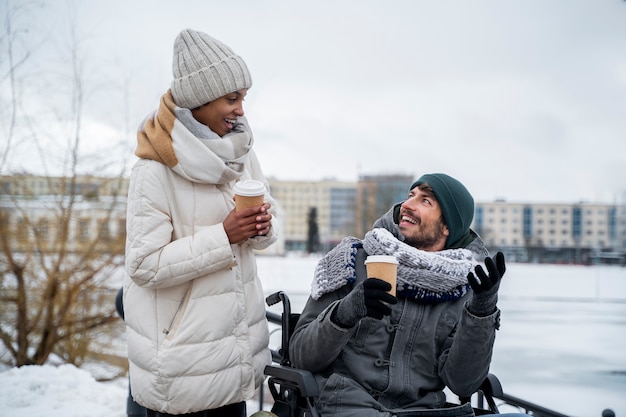 Woman having fun with her her disabled friend