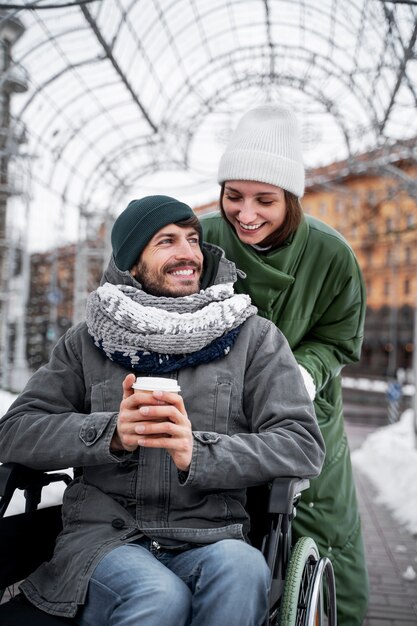 Woman having fun with her her disabled friend