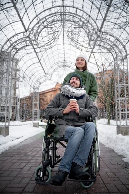 Free photo woman having fun with her her disabled friend