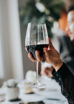 Woman having a glass of red wine