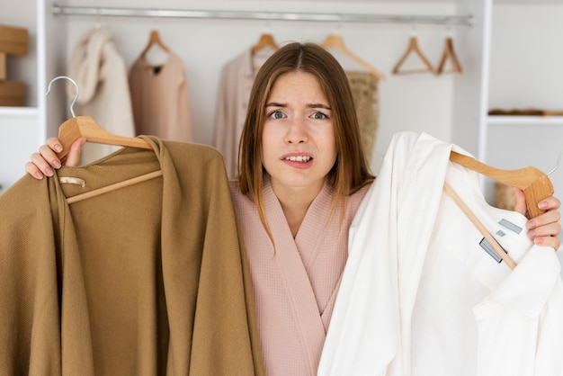 Free photo woman having a hard time deciding what to wear