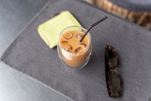 Woman having an iced coffee break outside