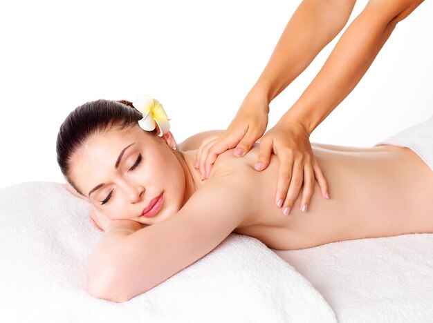 Woman having massage of body in the spa salon. Beauty treatment concept.