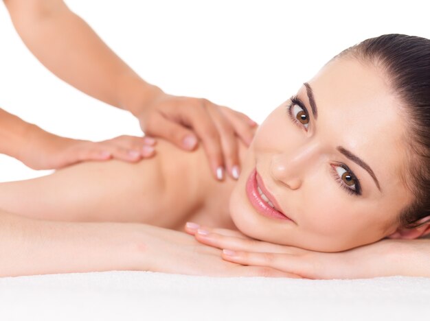 Woman having massage of body in the spa salon. Beauty treatment concept.