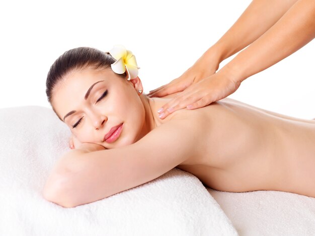 Woman having massage of body in the spa salon. Beauty treatment concept.