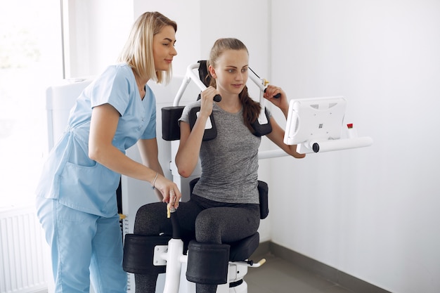 Woman having rehabilitation after injury in physiotherapy room