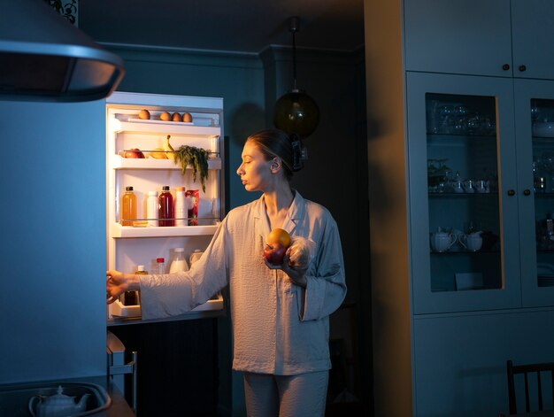 Woman having snacks front view