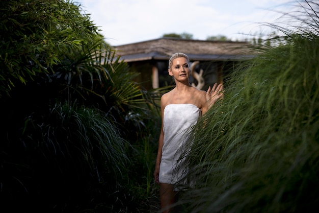 Woman having some quality time at a spa hotel outdoors