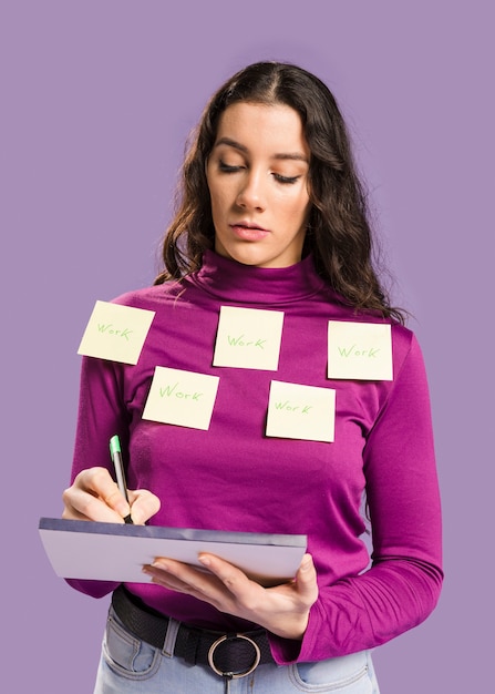 Woman having sticky notes on her blouse