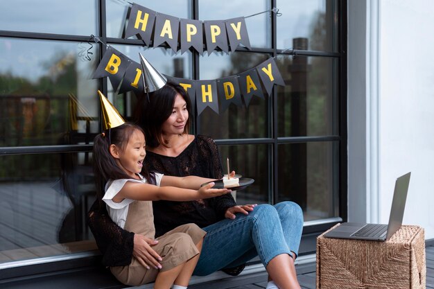 Woman having a video call with her husband on their daughters birthday