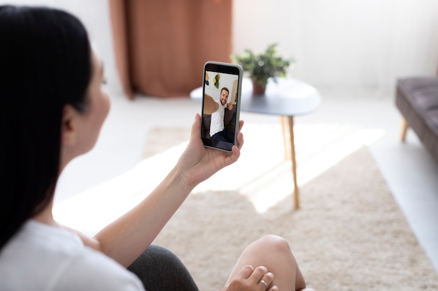 Woman having a videocall with her family