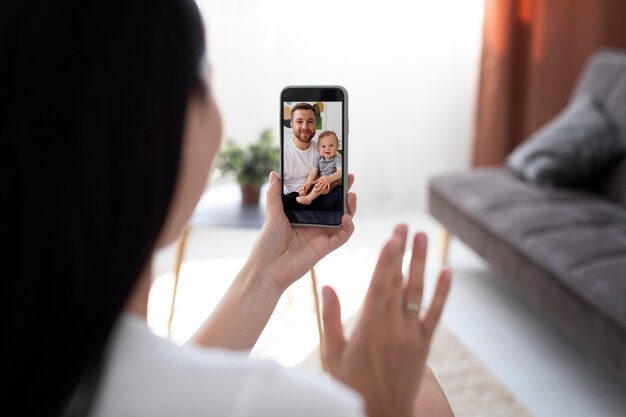 Woman having a videocall with her family