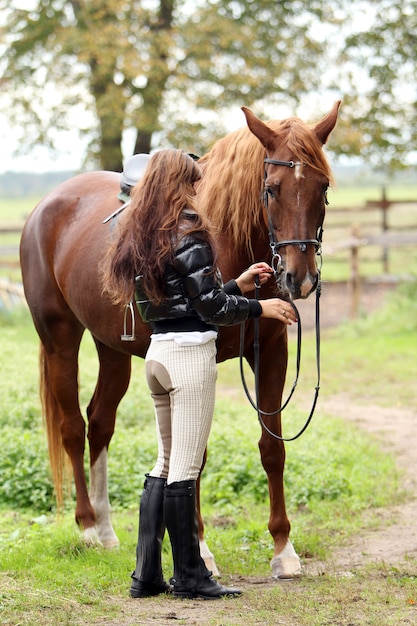 Woman and her brown horse