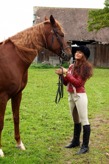 Woman and her brown horse