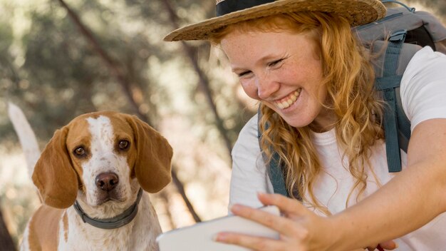 Woman and her dog having a good time outdoors