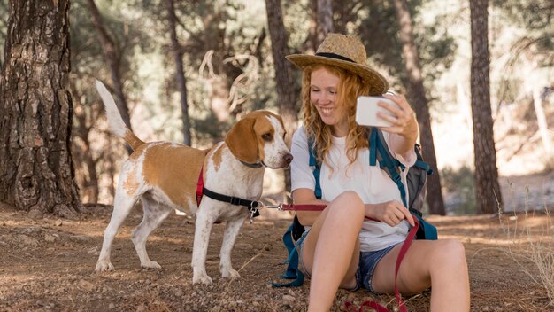 Woman and her dog having a good time and taking a selfie