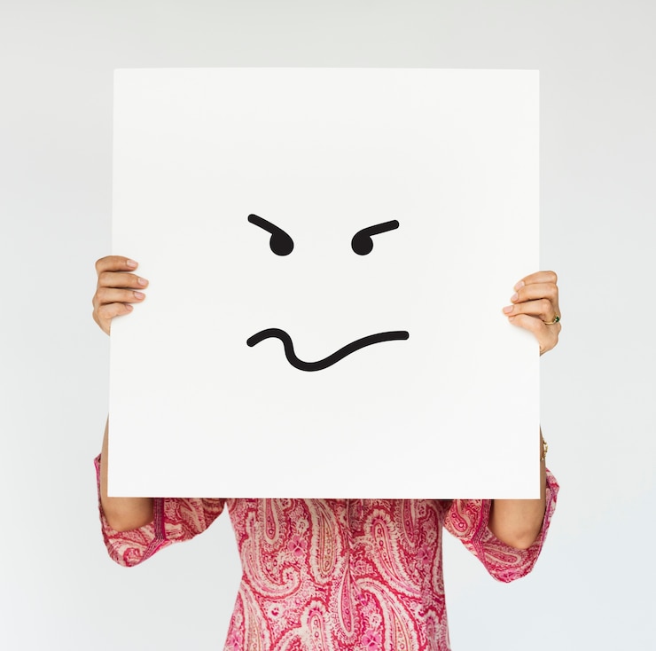 Free Photo woman holding angry banner cover her face