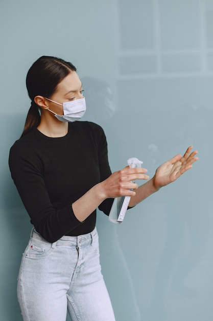 Free photo woman holding antiseptic in her hands