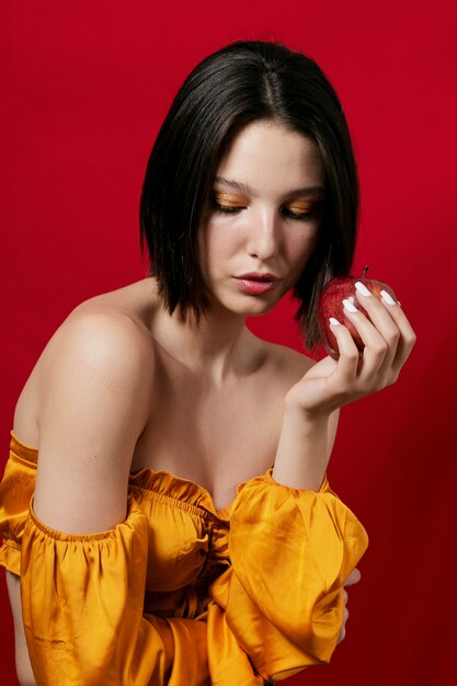 Woman holding apple in hand