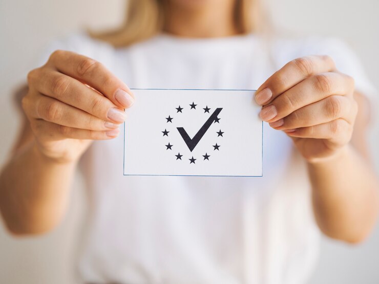 Free Photo woman holding a ballot close-up