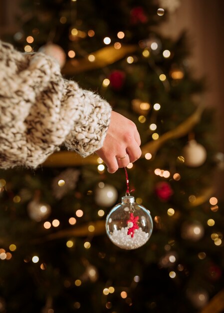 Woman holding bauble in hand