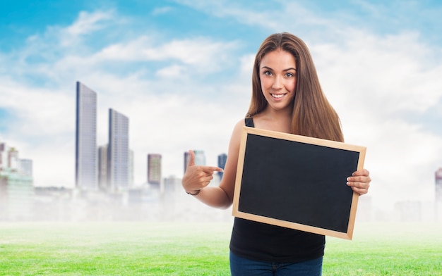 Woman holding a blackboard