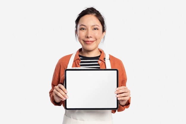 Woman holding blank tablet with design space