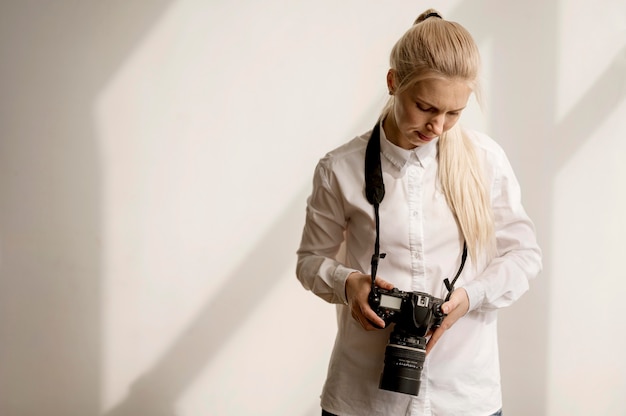 Woman holding a camera photo