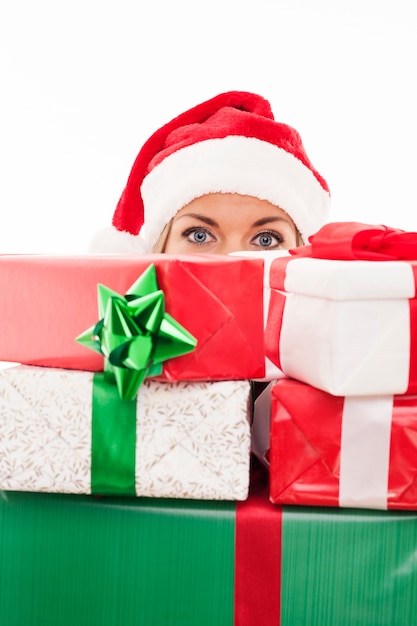 Woman holding christmas present in front of face