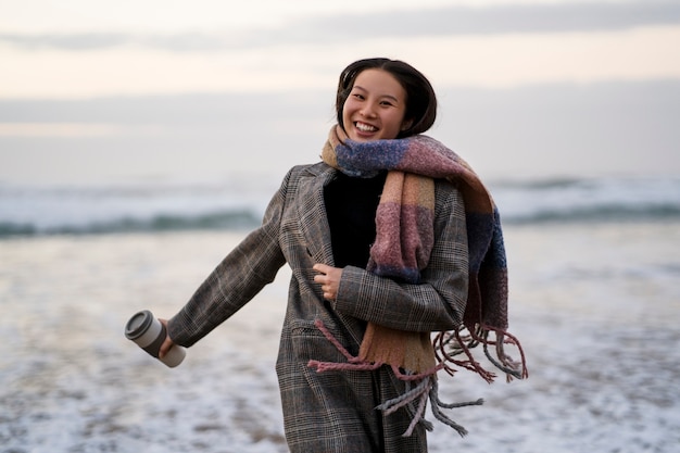 Woman holding coffee cup front view