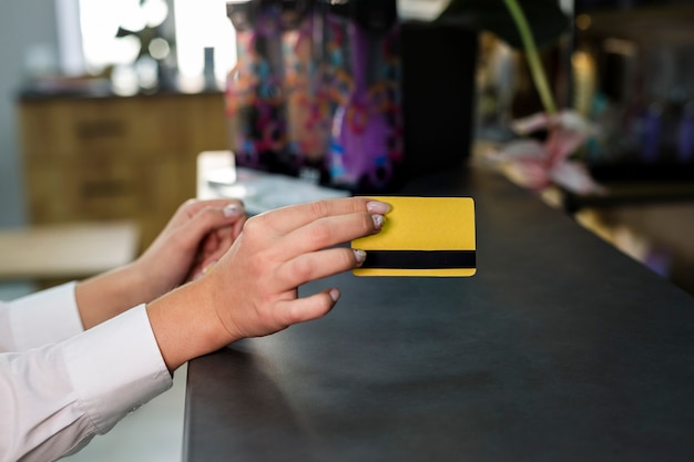 Free photo woman holding credit card mock-up