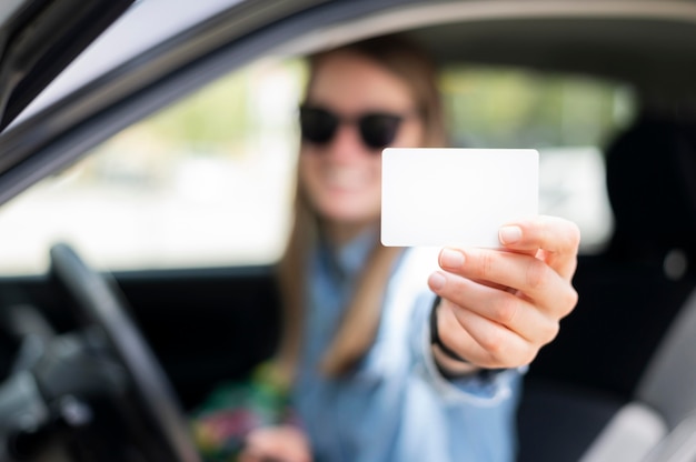Free photo woman holding credit card